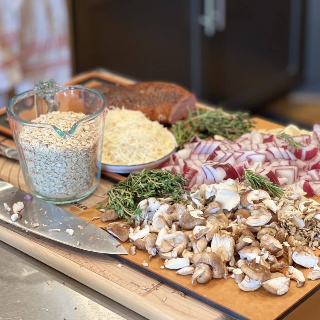 Chopped onions and mushrooms, with gluten free oats, shredded parmesan, and herbs, all prepared to make rice-free gluten free risotto